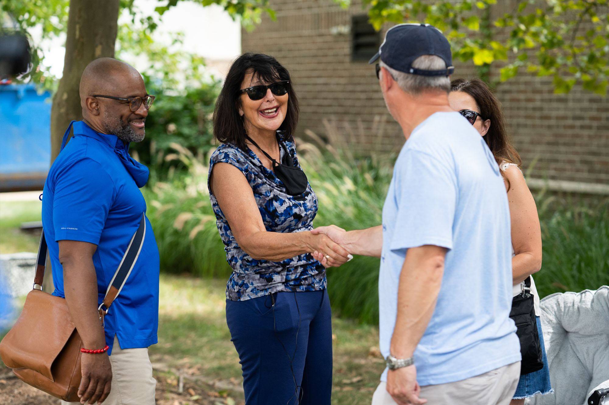 President Philomena V. Mantella and B. Donta Truss, left, vice president for Enrollment Development and Educational Outreach, greet students and their supporters during move-in.